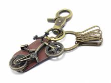Schl&uuml;sselanh&auml;nger Fahrrad Metall/Feinsynthetik antikmessing/braun matt